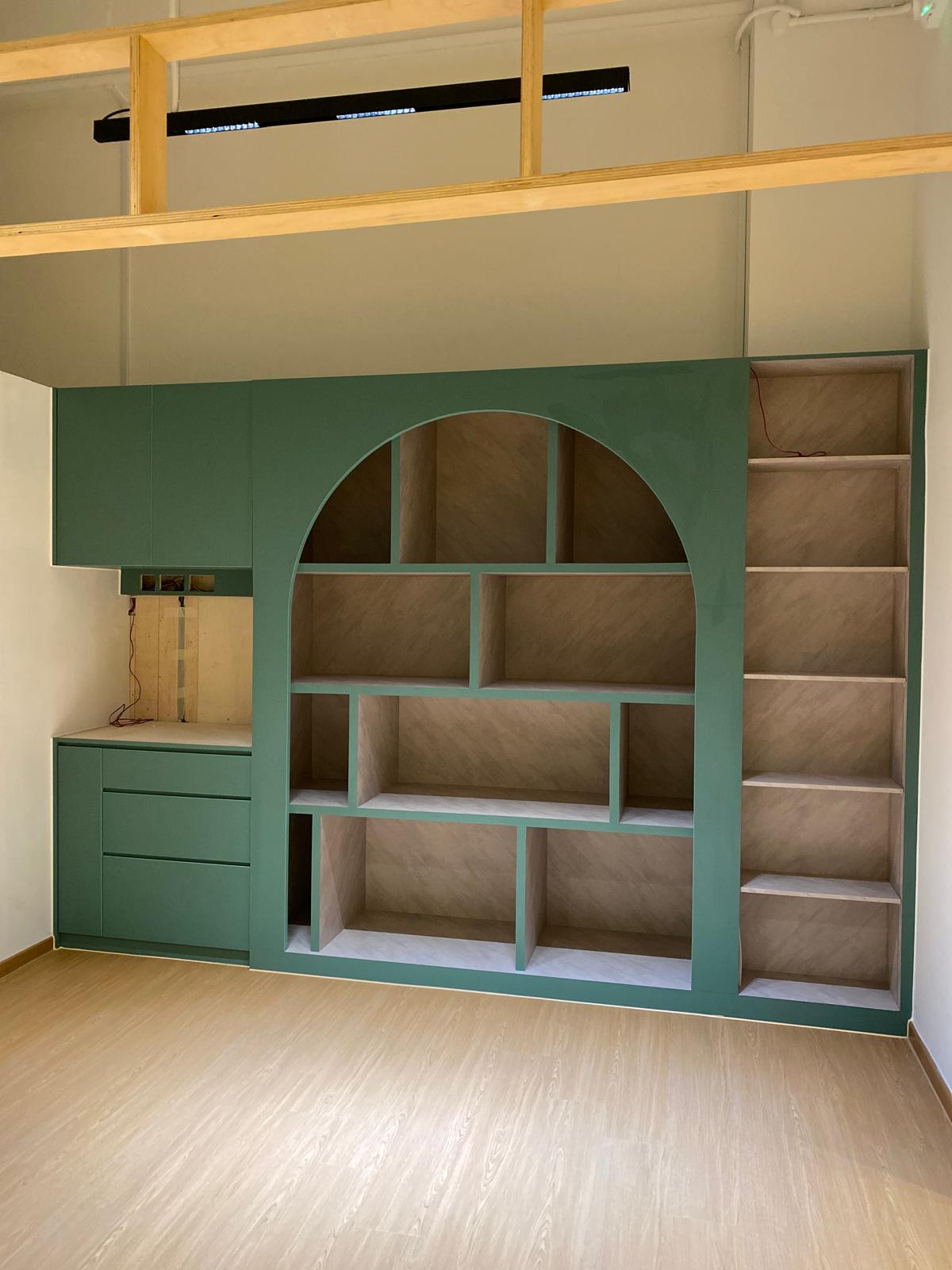 Custom green arched feature shelving unit