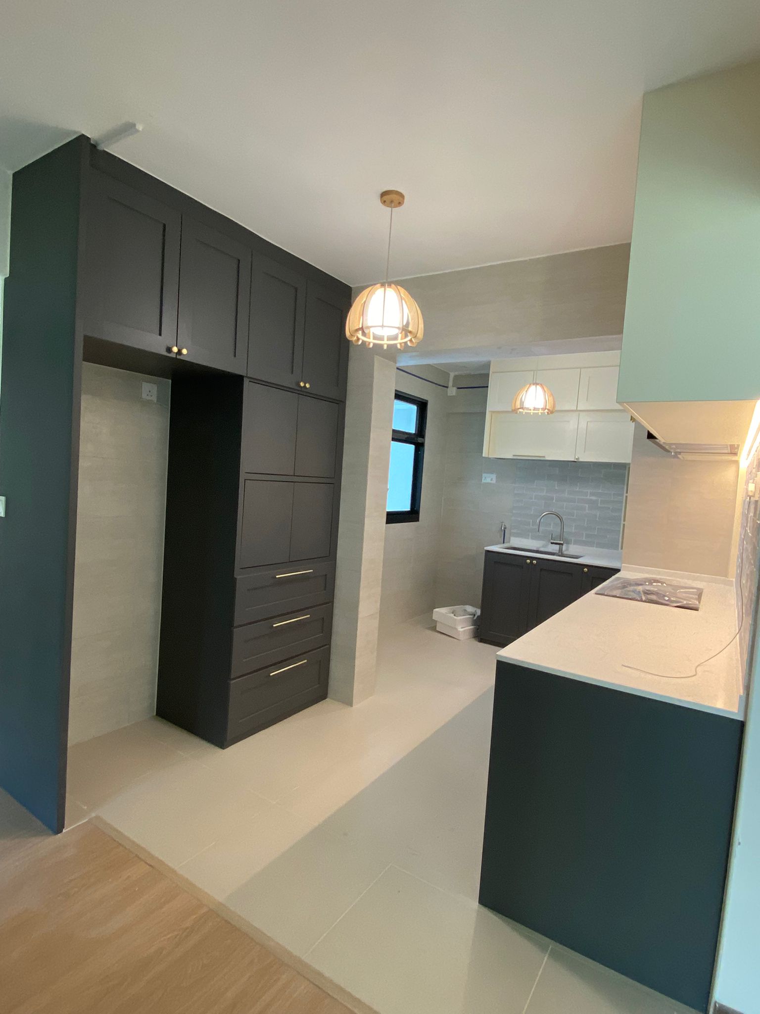 Open-plan kitchen and dining area with tall storage cabinetry